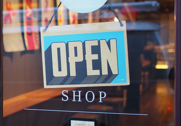 A sign on a shop door that reads, "open"