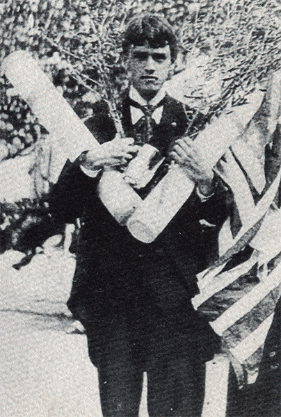 Thomas Burke, BU Law Class of 1897, holding wreaths of laurel to symbolize his two victories at the first modern Olympic Games
