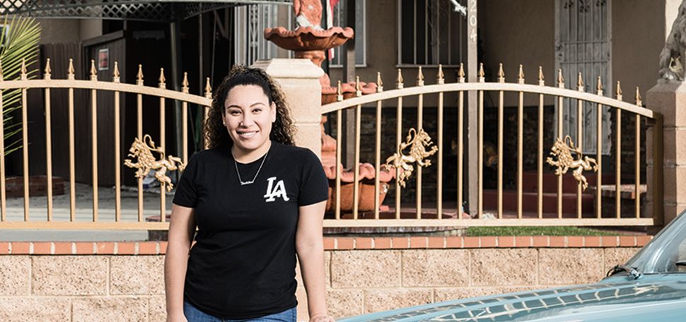 Daisy Figueroa ('21) stands in her Southeast LA neighborhood