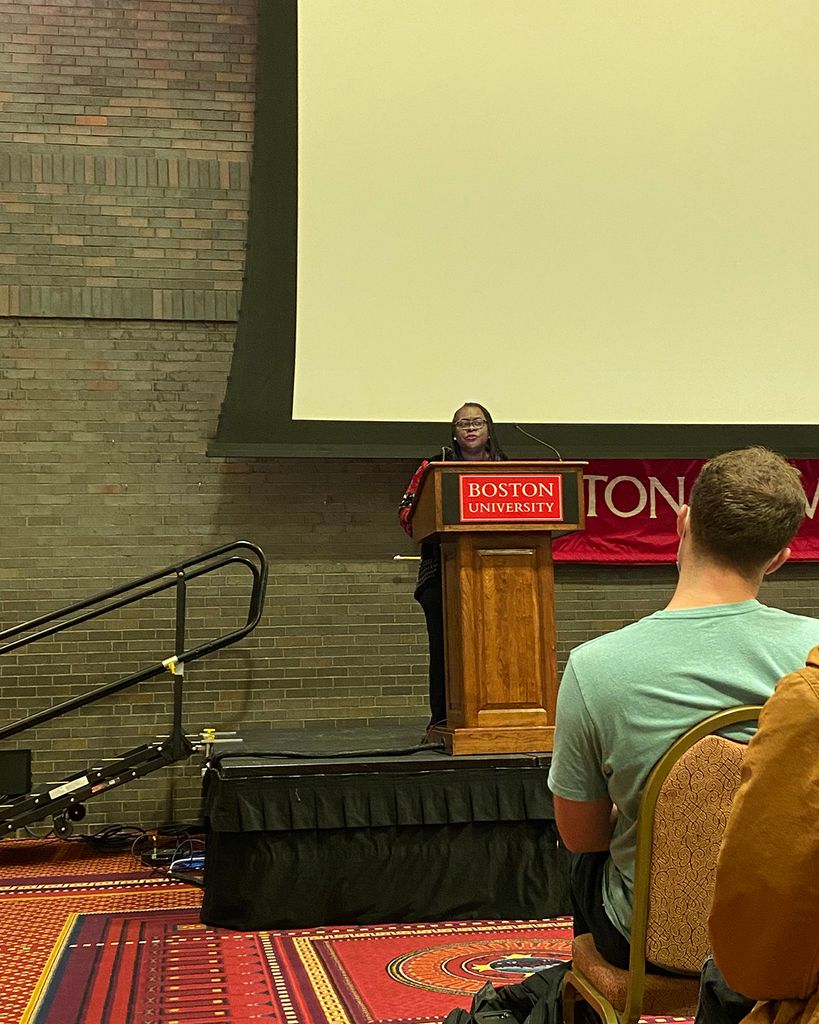 Dean Angela Onwuachi-Willig at a podium, welcomes the JD Class of 2024
