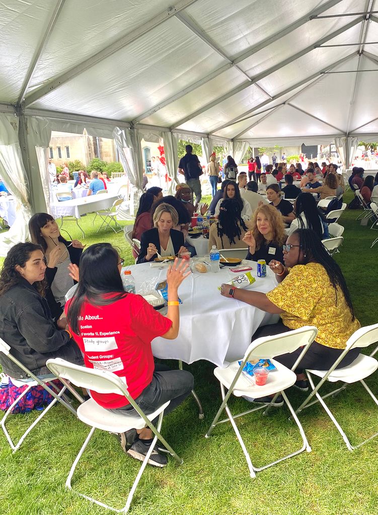 Dean Angela Onwuachi-Willig with students and faculty at a BBQ