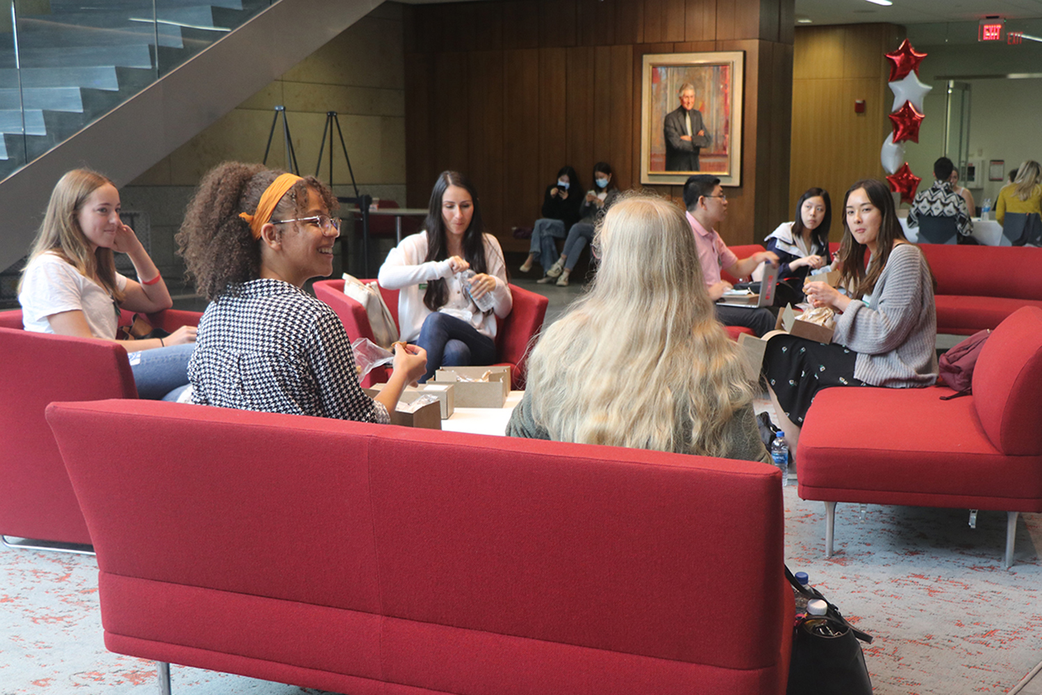 Students socialize in the BU Law Butler atrium