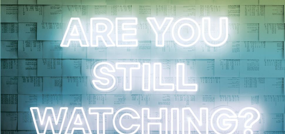 Neon text reading "Are You Still Watching?" with streaming video load bar and play button