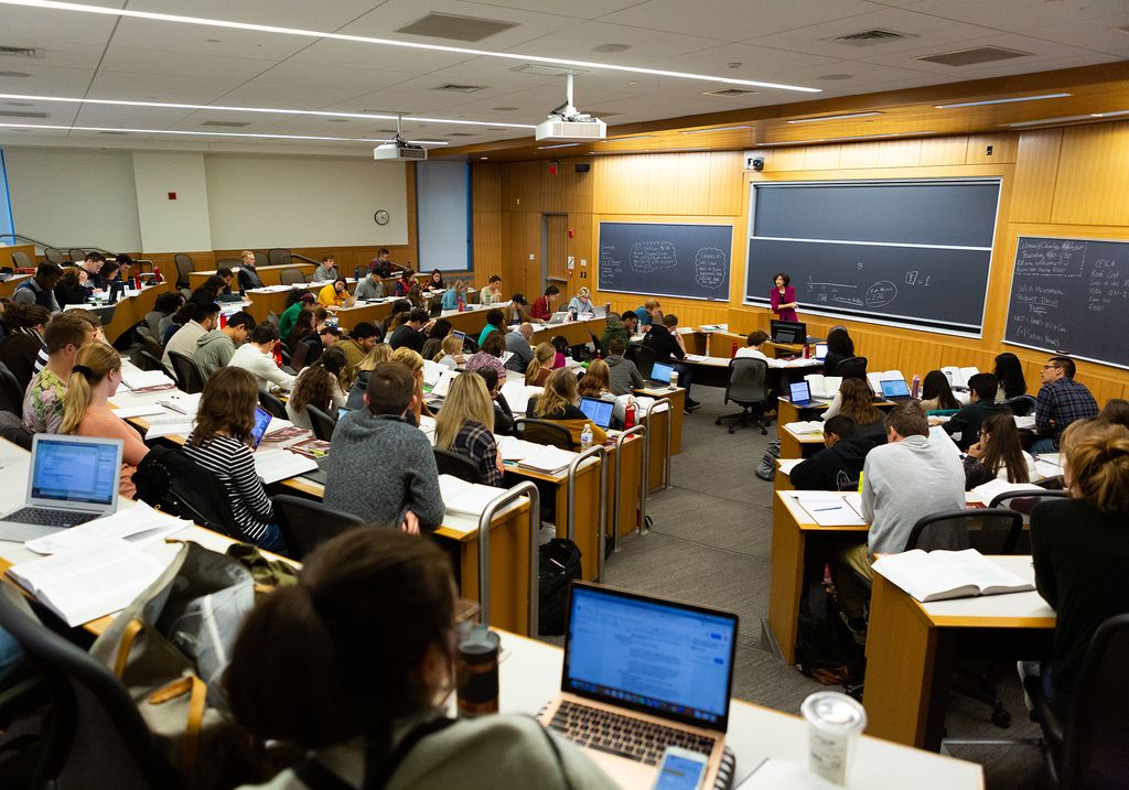 A 2019 photo of Professor Daniela Caruso teaching a class in the Redstone building