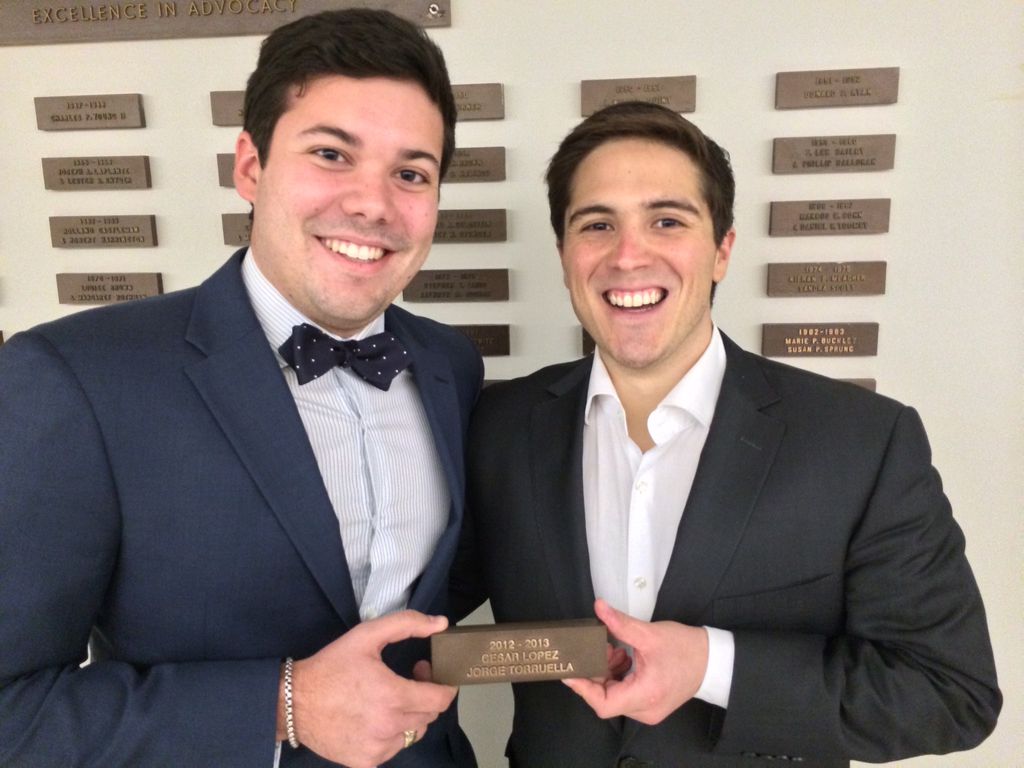 Cesar Lopez-Morales ('14) and Jorge Torruella ('14) with the plaque commemorating their 2012-13 Albers Moot Court win