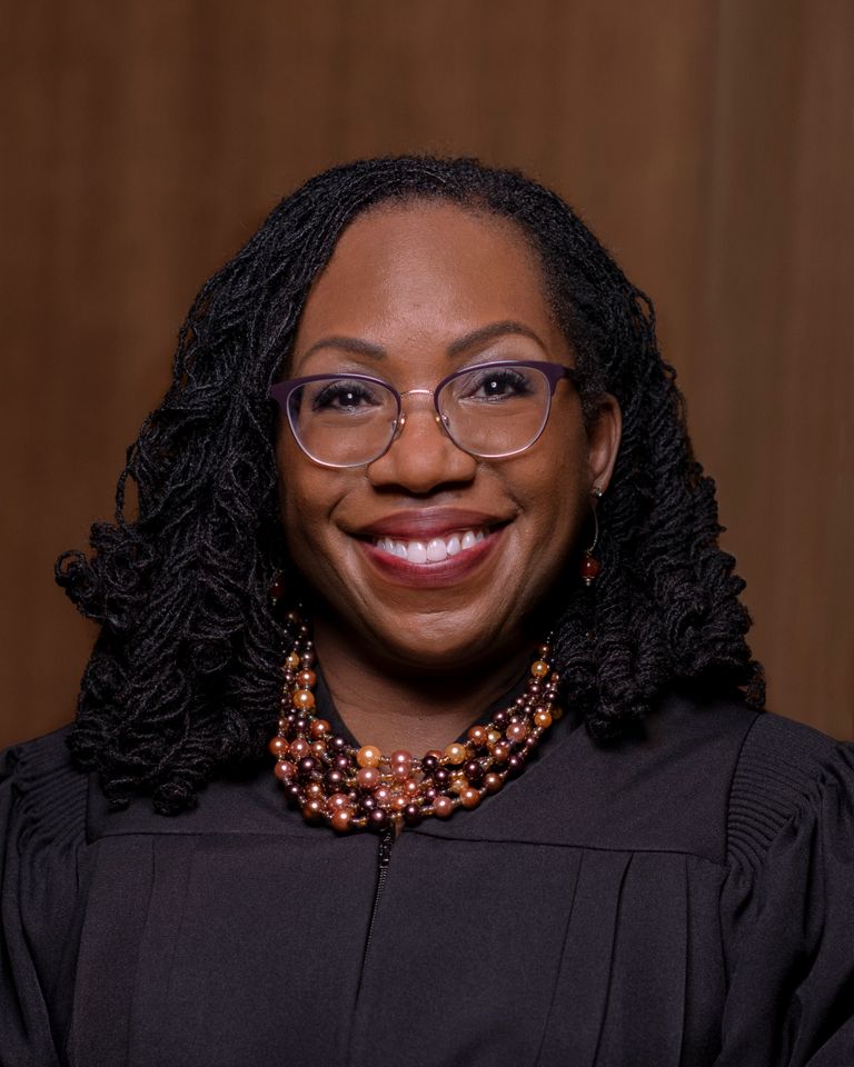 Portrait of Associate Justice Ketanji Brown Jackson smiling in a black robe.