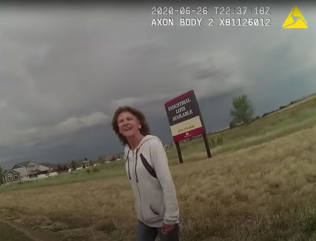 A still image of Karen Garner walking along a Colorado highway. Taken from Colorado police bodycam footage.