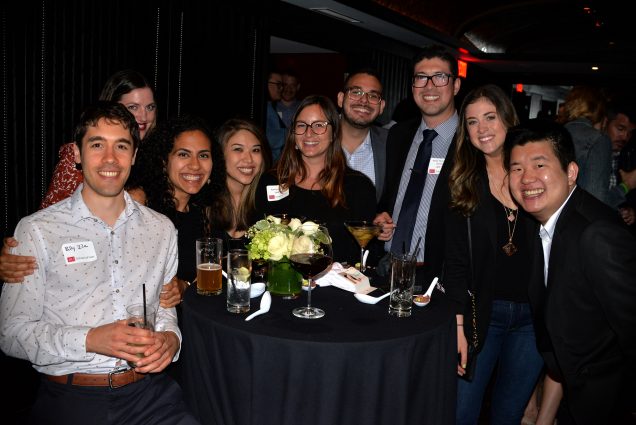 A group of BU Law alumni gather around a table during the 2019 Reunion Weekend celebrations