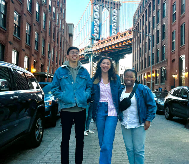 Burak Sirrik (’25), Samantha Ligori ('25), and Sharon Mamuya (’25) in New York City with the Brooklyn Bridge in the background
