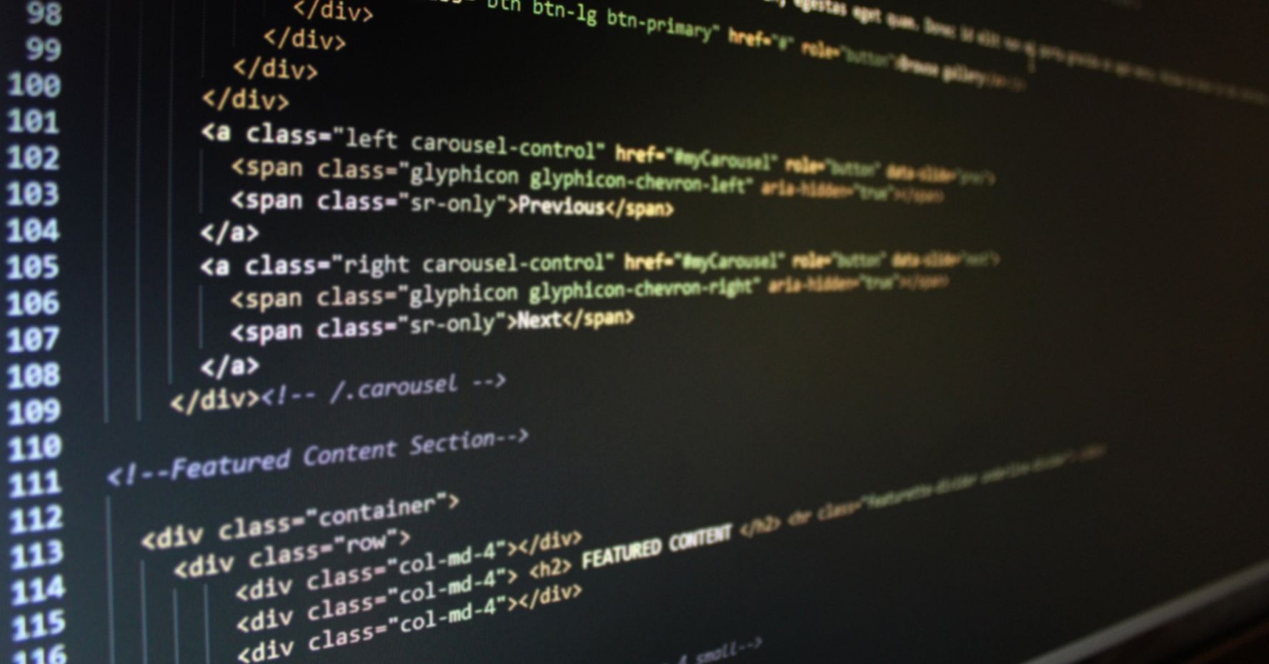 HTML code on a dark screen.
