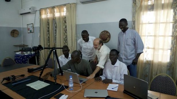 Roger Brisson (4th from left) and Fallou Ngom (standing right) training the Senegal team