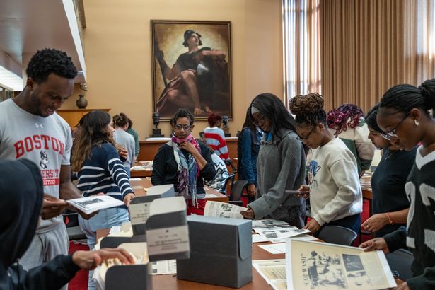 Students engaging with archival materials in the Howard Gotlieb Center Reading Room.