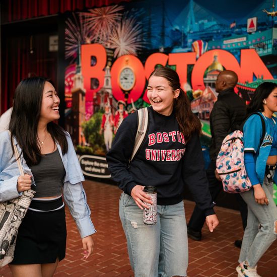 students walk down a street in Downtown Boston