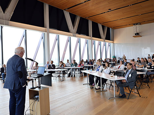 A group photo of the PMIP 2024 conference team, including Project Management program director Vijay Kanabar and Master Lecturer Richard Maltzman