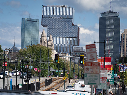 Wide shot of BU Campus along Commonwealth Avenue, with several notable buildings visible in the background