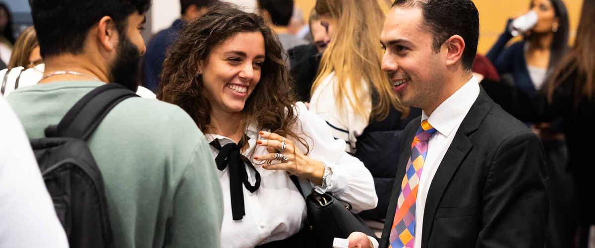 MET students socializing at a networking event