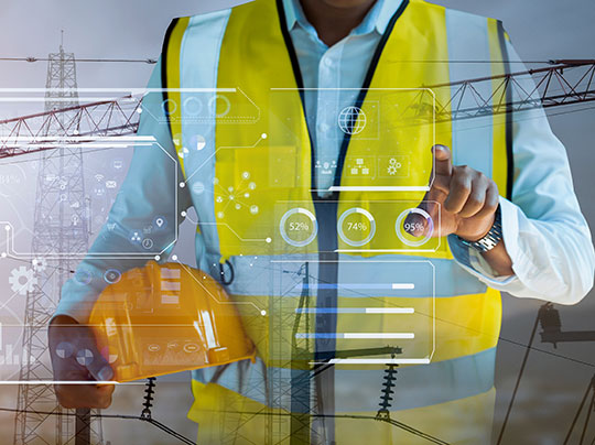Concept artwork of a construction manager using a digital interface while holding a hard hat