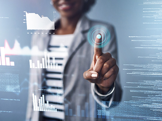 A businesswoman interacting with an illustration of financial data