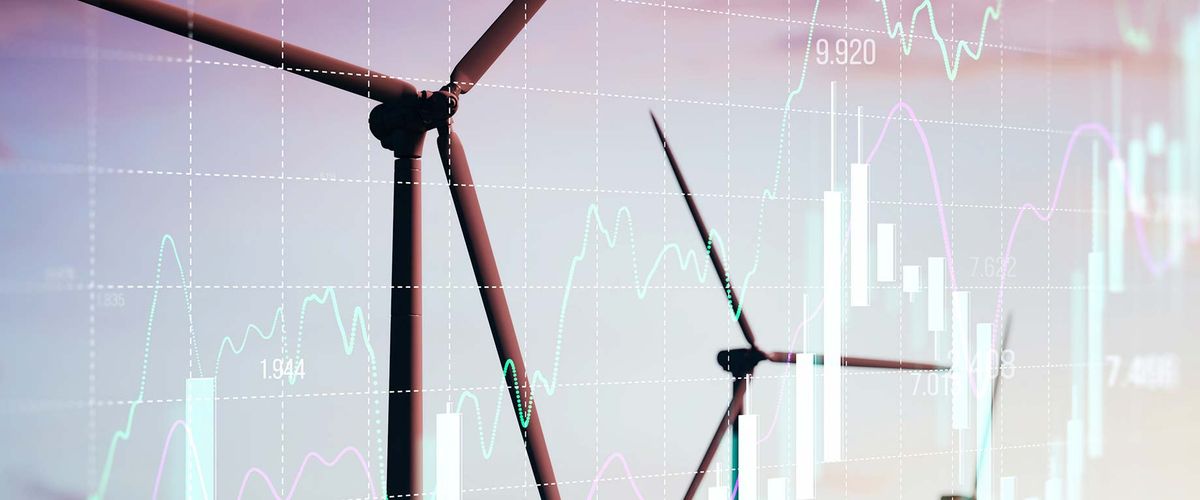 Wind turbines overlayed with an illustration of financial data