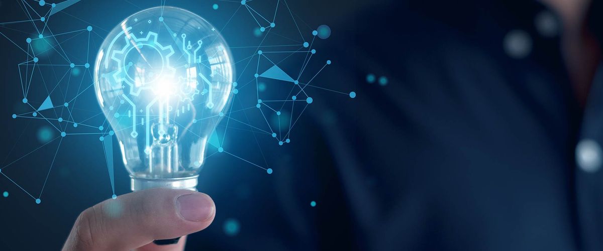 Image of a man holding a lightbulb overlayed with imagery evoking innovation