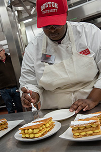 Kayla Tabb working in the kitchen at Boston University Food Studies Pastry Arts Program.