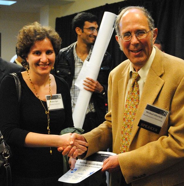 Limor Eger receives a diploma from Dr. M. Slilevitch