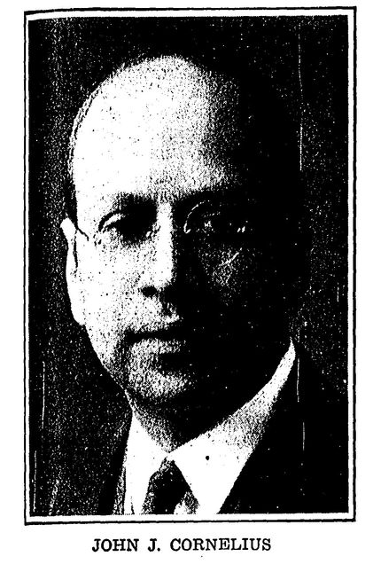 black and white headshot of an individual middle aged male wearing glasses