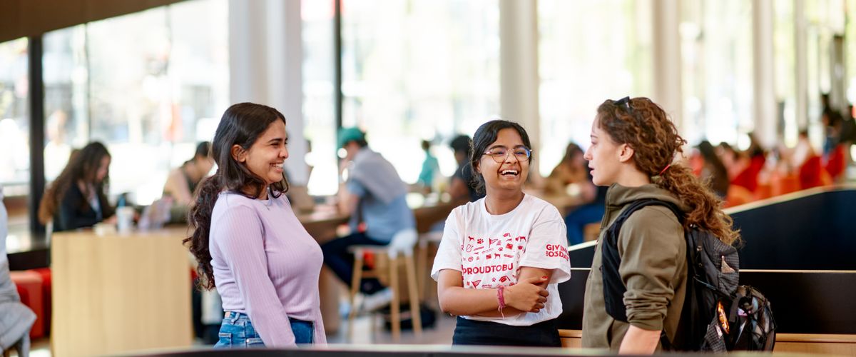 Students Laughing inside of CDS building
