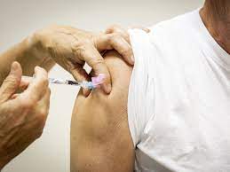 A patient is inoculated against SARS-CoV-2 in the Netherlands on October 2, 2023. While unpleasant, side-effects of the vaccine such as headaches and chills may be an indication that the vaccine is building a stronger immune response and defense against future infections. PHOTOGRAPH BY KOEN VAN WEEL, ANP/REDUX BY SANJAY MISHRA and loved ones who I come in contact with."