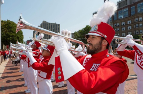 Closeup of man in a marching band playing the trumpet