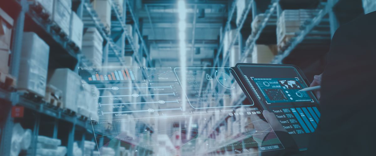 Person using a tablet in a warehouse setting