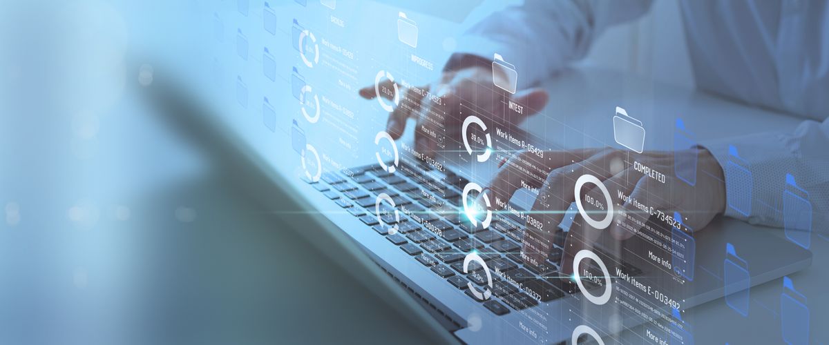 Digital illustration of a man typing on a laptop. The screen is not visible, but charts and folders are digitally imposed in front of his fingers as if showing what might be on the screen.