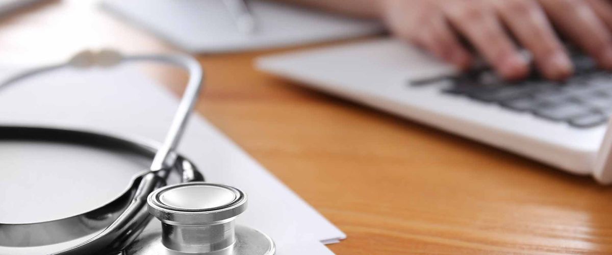 Stethoscope, hands, laptop