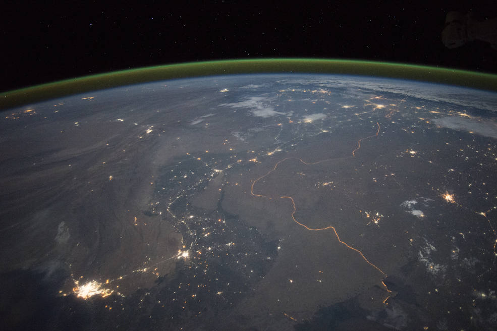 The bright orange line is the India-Pakistan border lit up at night and photographed from space.