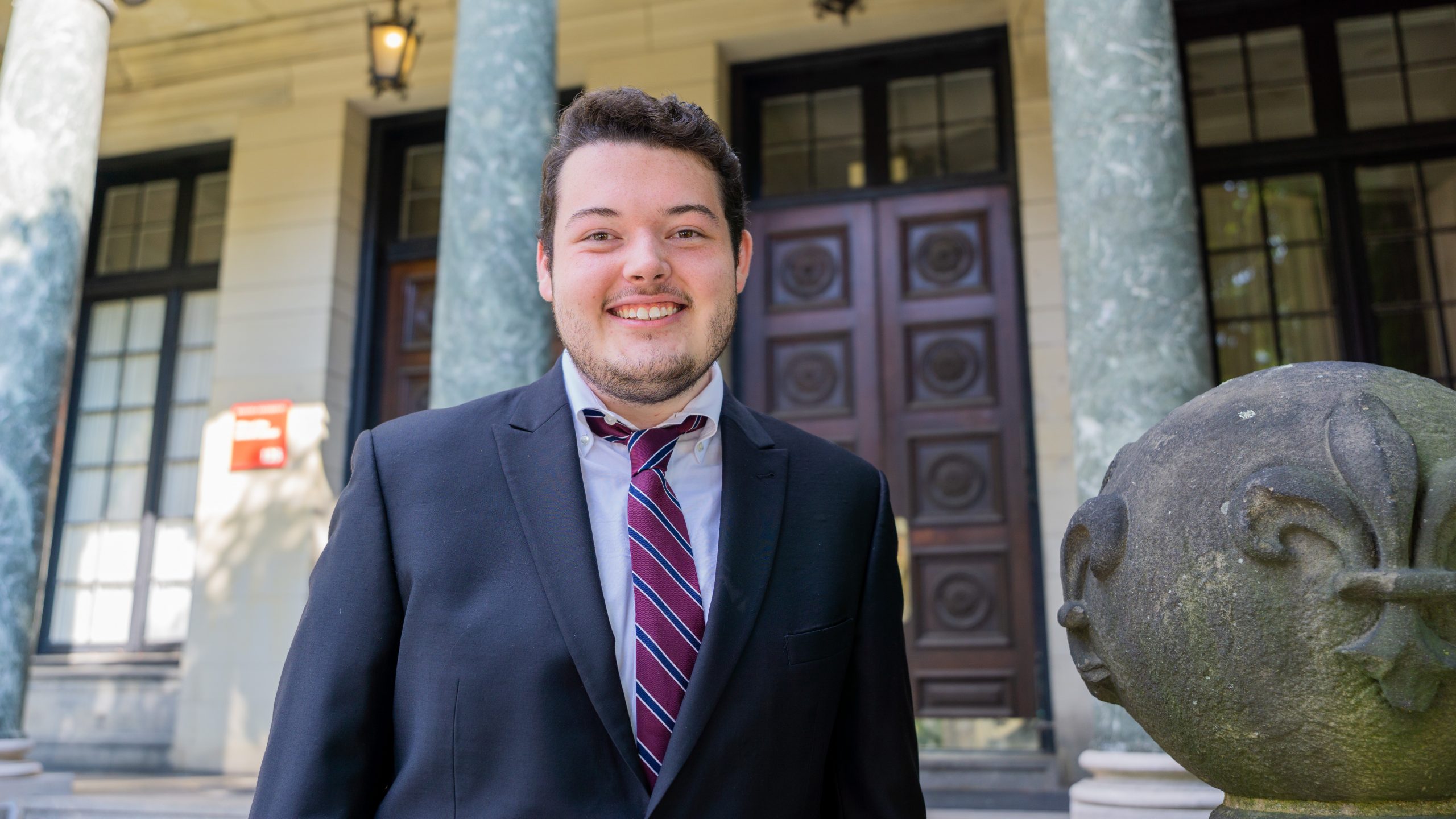 Joshua Wright (BA IR '22) in front of the Pardee School of Global Studies. 