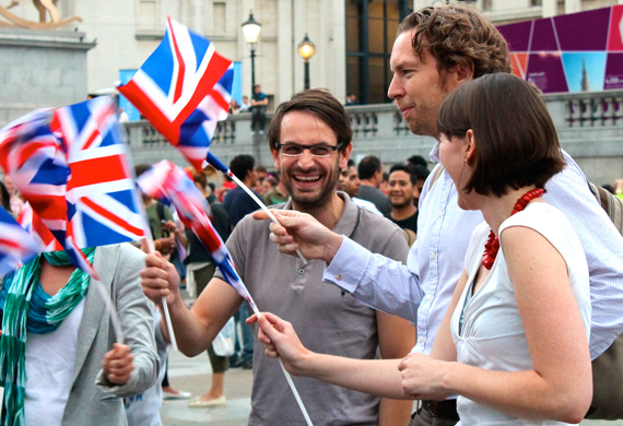 Group of Brits wave flags in anticipation for Opening Ceremonies. Group of Brits wave flags in anticipation for Opening Ceremonies. Photo by Amy Gorel © Boston University News Service.