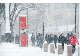 Students walking on the Commonwealth Ave sidewalk at Marsh Plaza. Photograph by Vernon Doucette