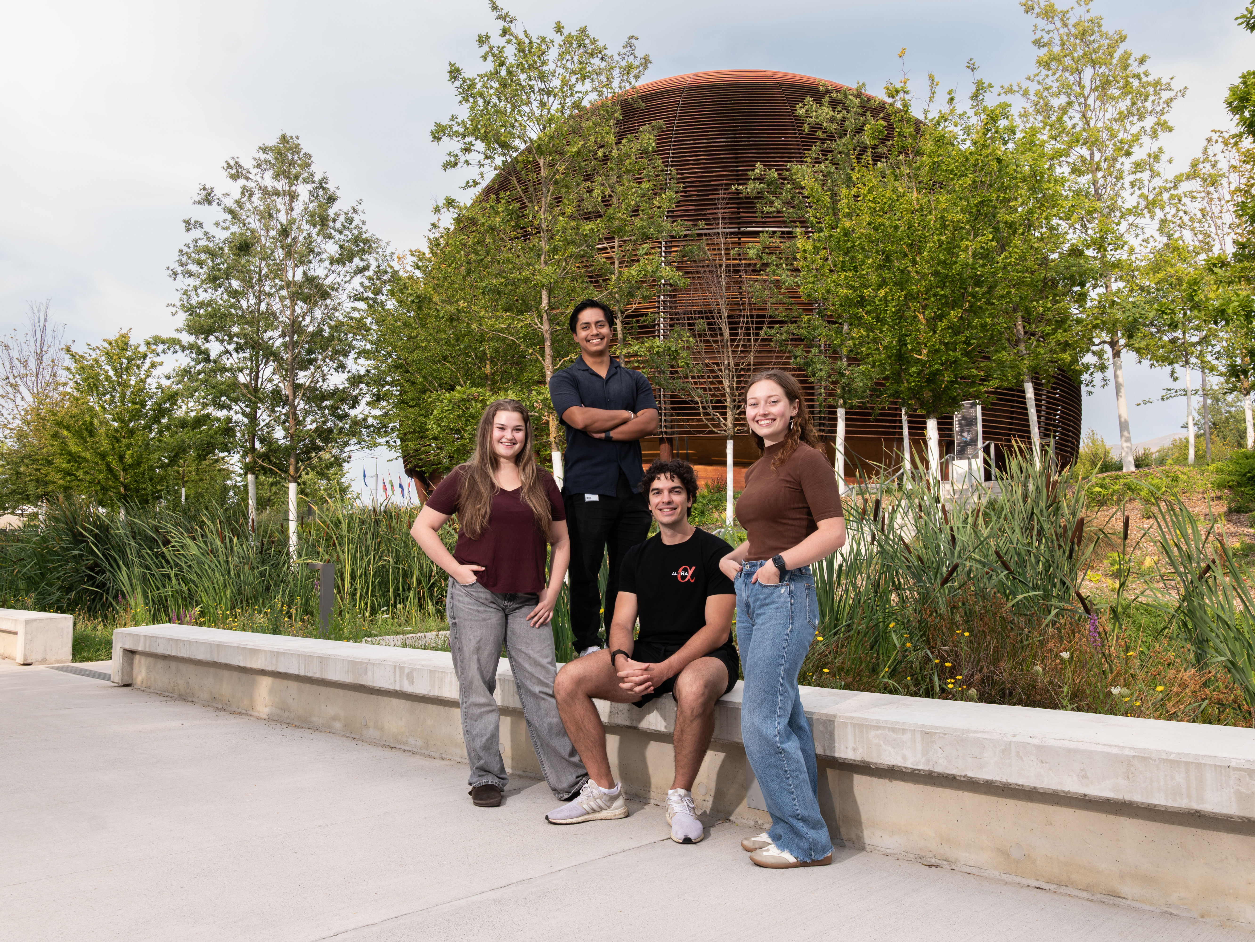 Four BU Geneva Physics students outside CERN’s Globe of Science and Innovation