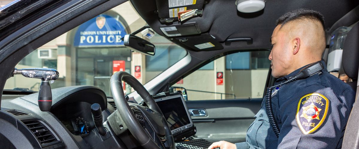 BUPD officer inside cruiser