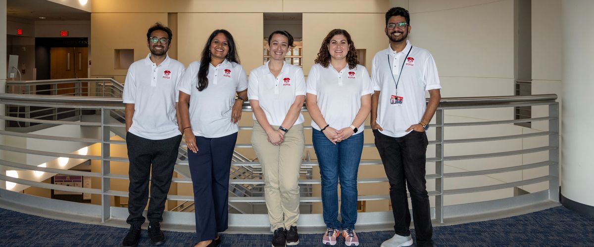 Members of the BU Postdoctoral Association stand together for a group photo.