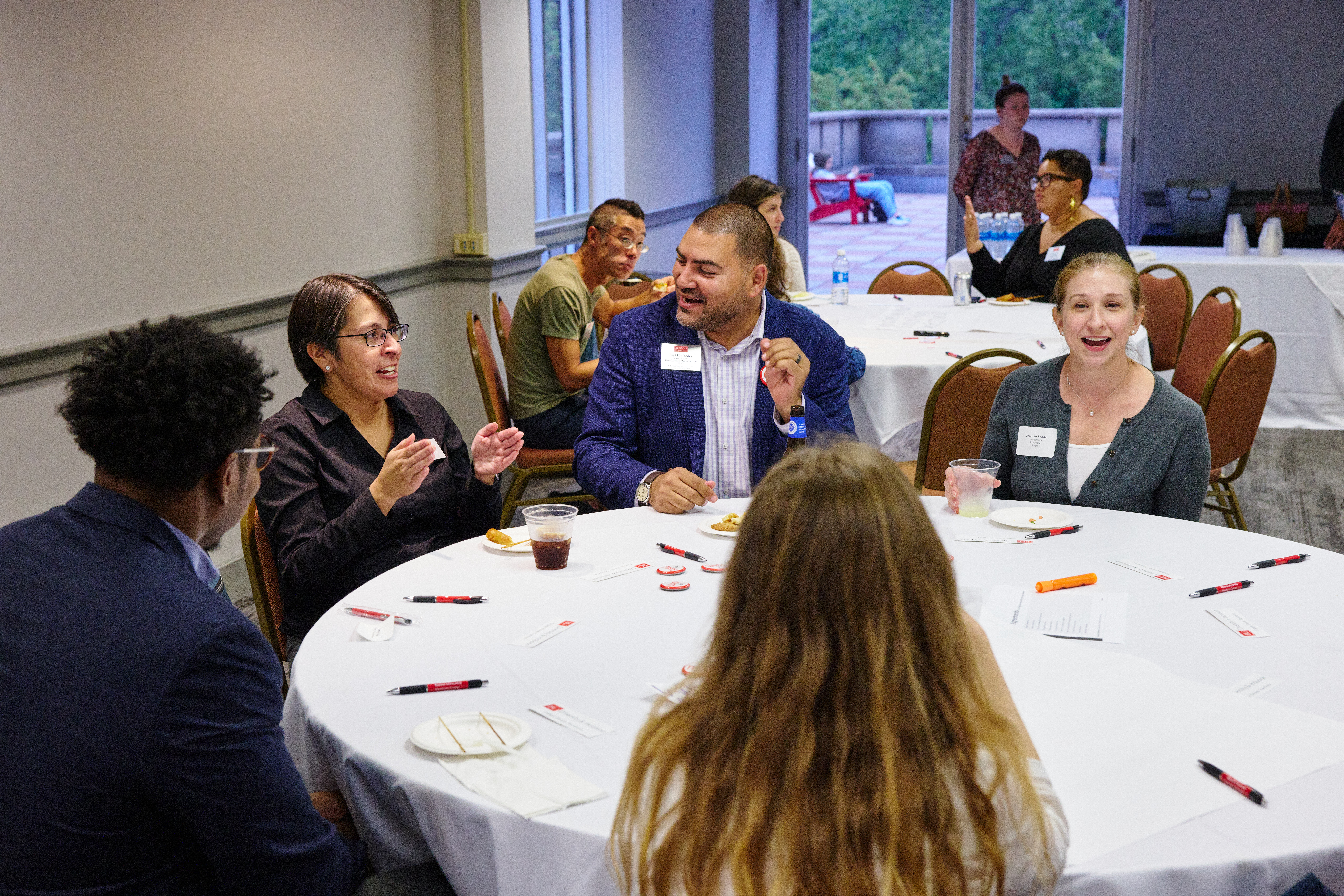 Faculty mingling at a reception for first generation faculty.