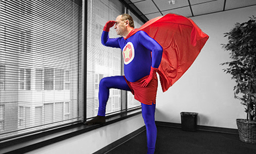 superhero looking out of office window