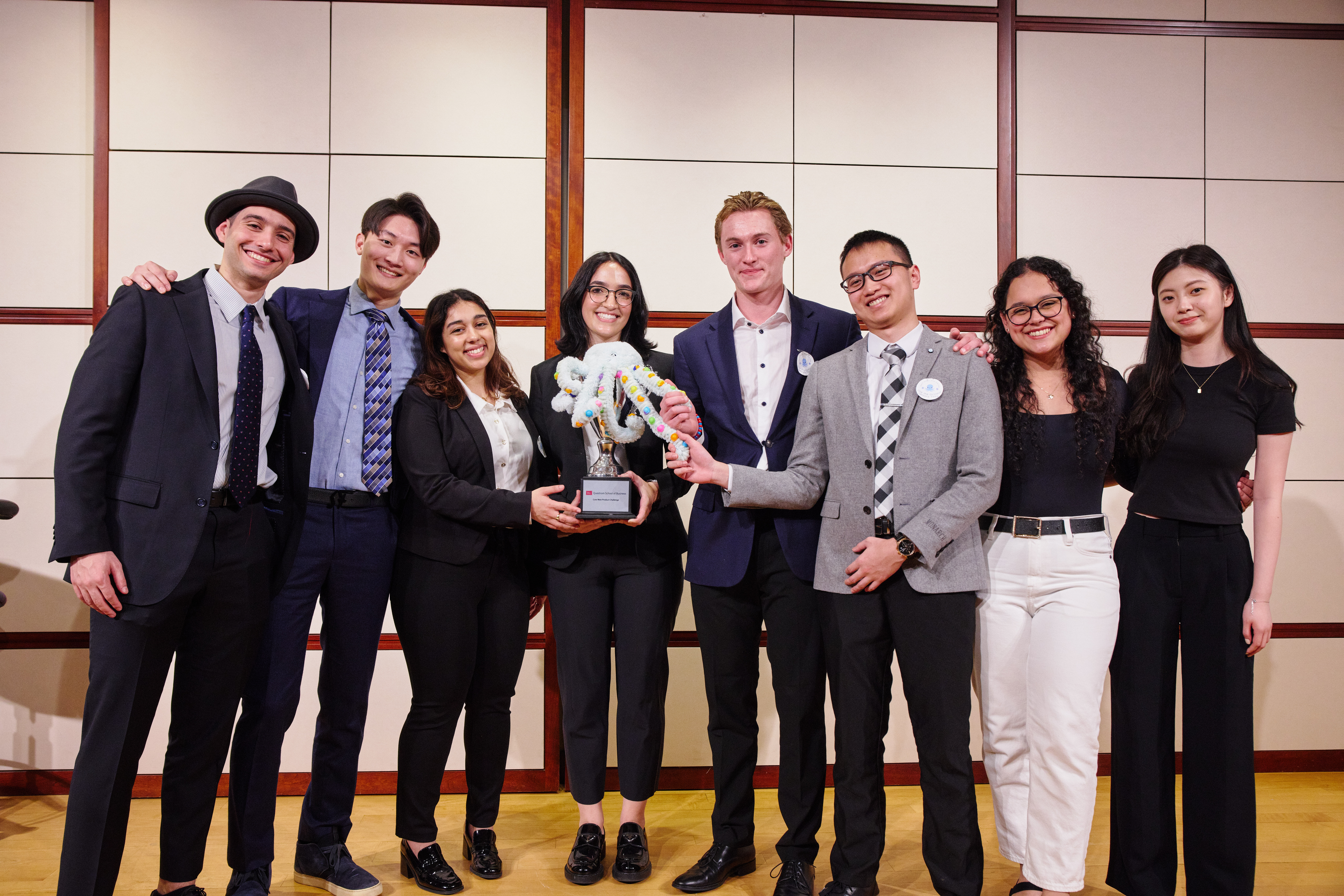 A core team stands on stage with their product