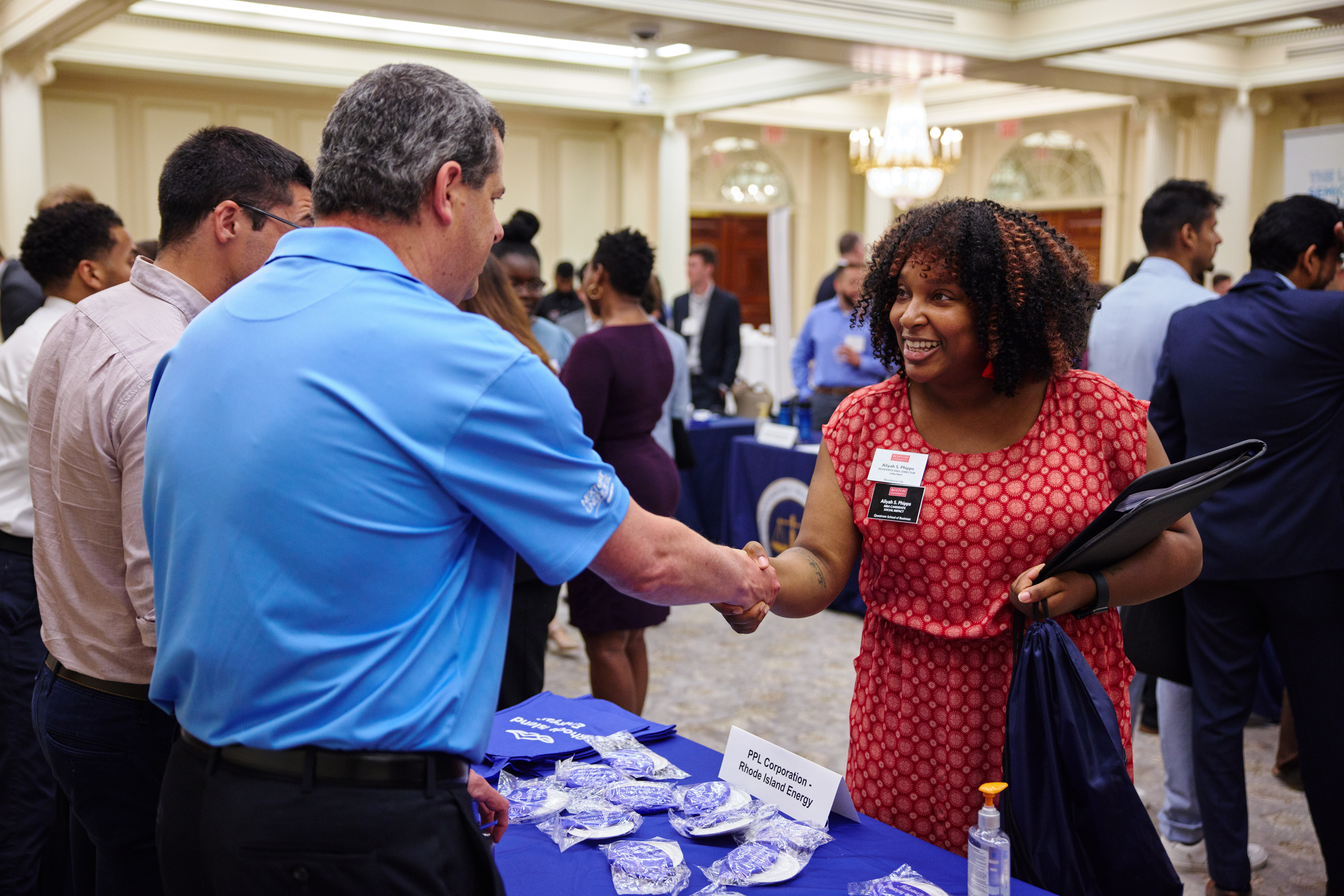 Employers meeting with students at career fair