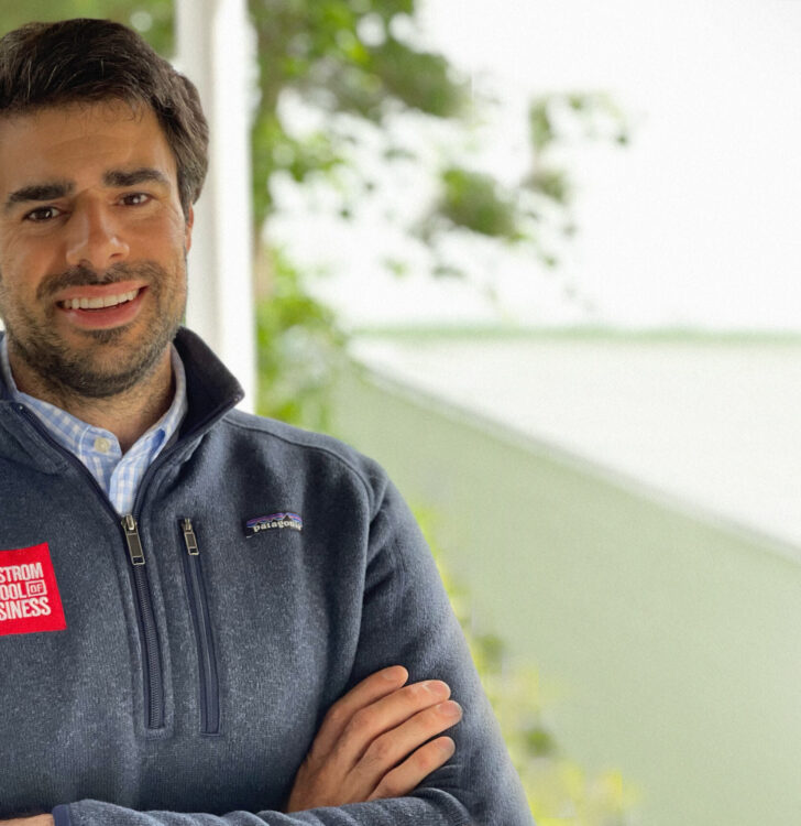 Student with short dark hair, tanned skin, brown eyes, smiling with arms crossed, Richard Fontes