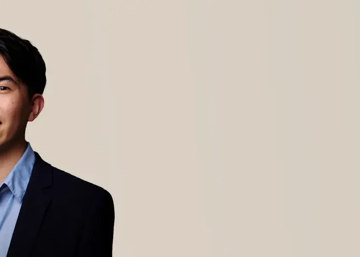 Jason Lin dressed smartly smiling
