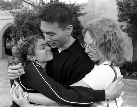 Friends of Lisa Frost comfort each other on Marsh Plaza