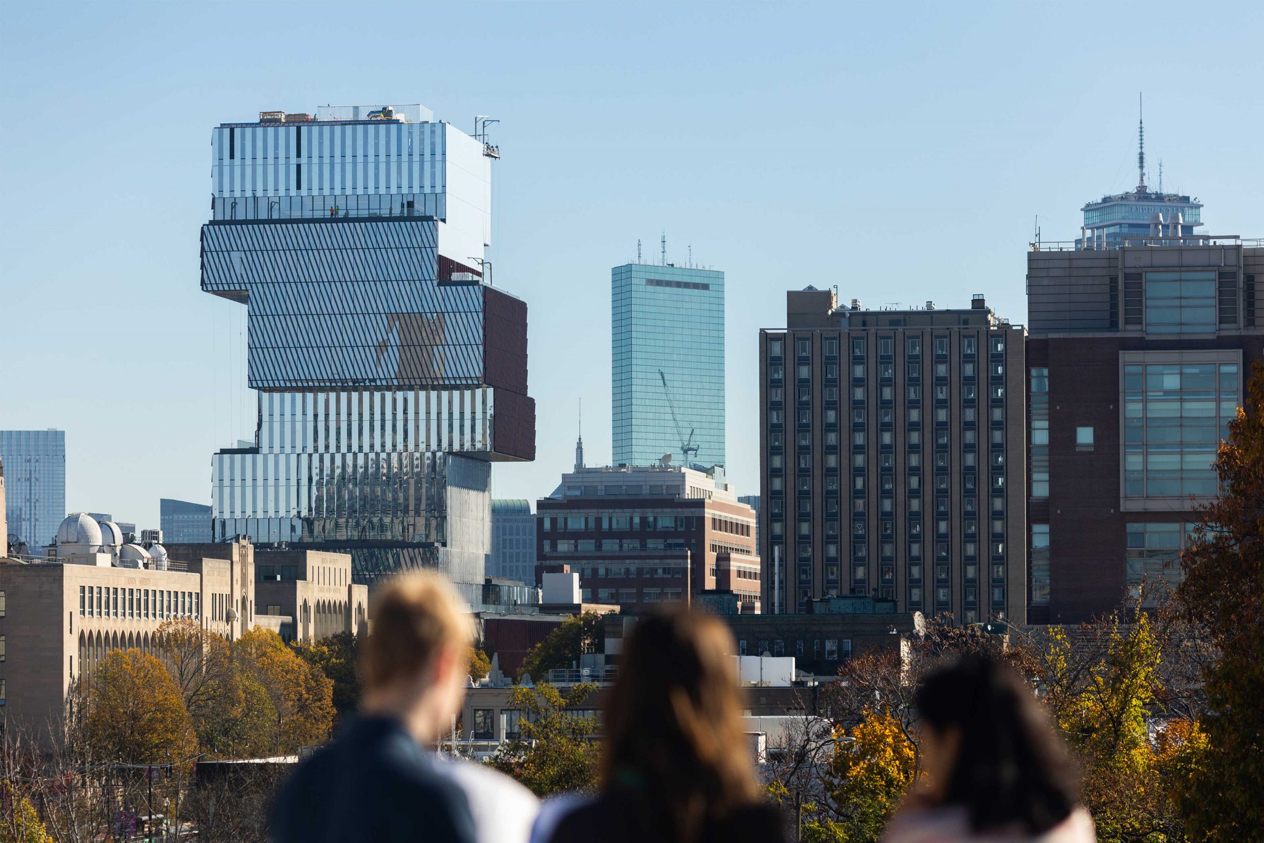 A view of buildings on Comm avenue and the Boston skyline from the rood of the Booth Theater