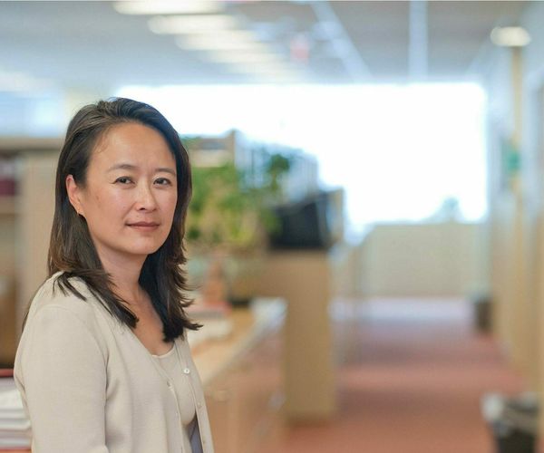 Faculty member looking at camera