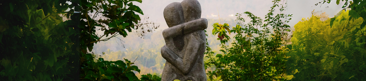 Stone sculpture of two people embracing